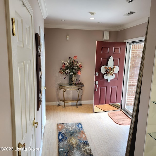 404 Eastgate Village Wynde, Louisville, KY 40223 - entryway featuring baseboards, ornamental molding, plenty of natural light, visible vents, and wood finished floors