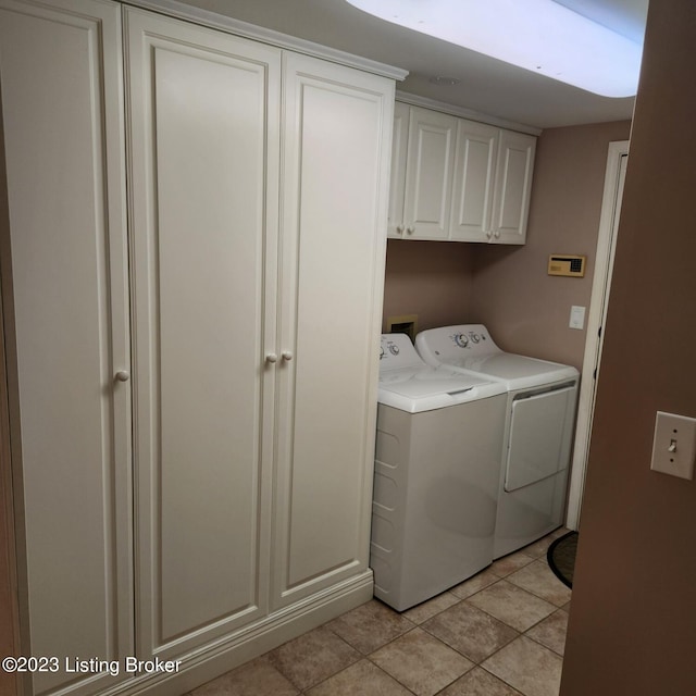 404 Eastgate Village Wynde, Louisville, KY 40223 - laundry area with cabinet space, light tile patterned floors, and independent washer and dryer