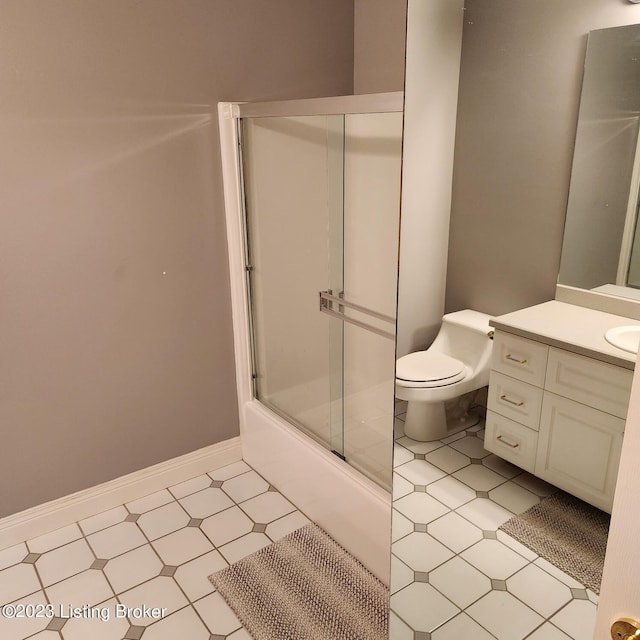 404 Eastgate Village Wynde, Louisville, KY 40223 - bathroom featuring toilet, enclosed tub / shower combo, vanity, and baseboards