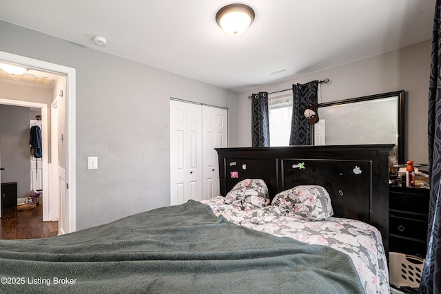 bedroom featuring a closet and wood finished floors