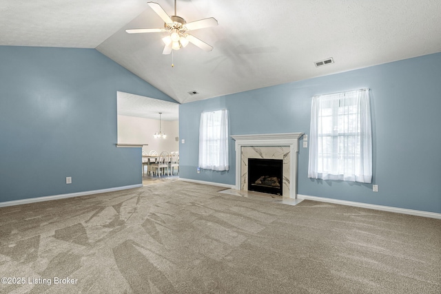 1112 Majestic Woods Dr, La Grange, KY 40031 - unfurnished living room featuring lofted ceiling, carpet, plenty of natural light, a ceiling fan, and a premium fireplace