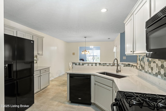1112 Majestic Woods Dr, La Grange, KY 40031 - kitchen featuring black appliances, a peninsula, a sink, decorative backsplash, and light countertops