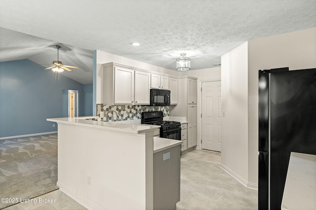 1112 Majestic Woods Dr, La Grange, KY 40031 - kitchen with black appliances, baseboards, a peninsula, light countertops, and decorative backsplash