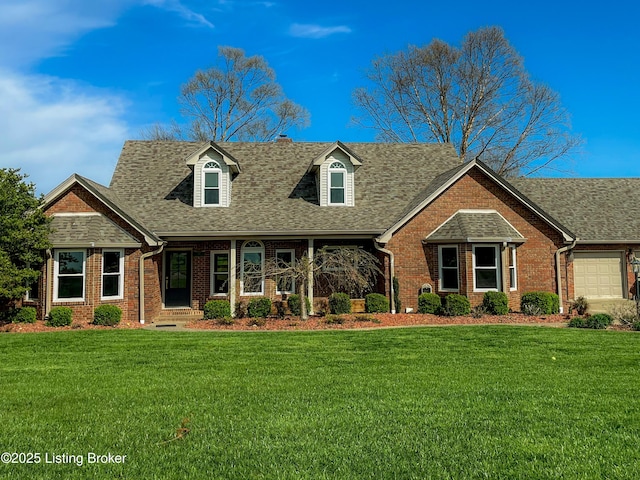 119 Fairway Dr, Hodgenville, KY 42748 - view of front of home with an attached garage, a front lawn, brick siding, and roof with shingles