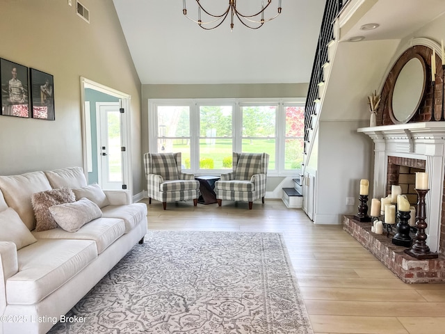 119 Fairway Dr, Hodgenville, KY 42748 - living room with visible vents, baseboards, wood finished floors, and a chandelier