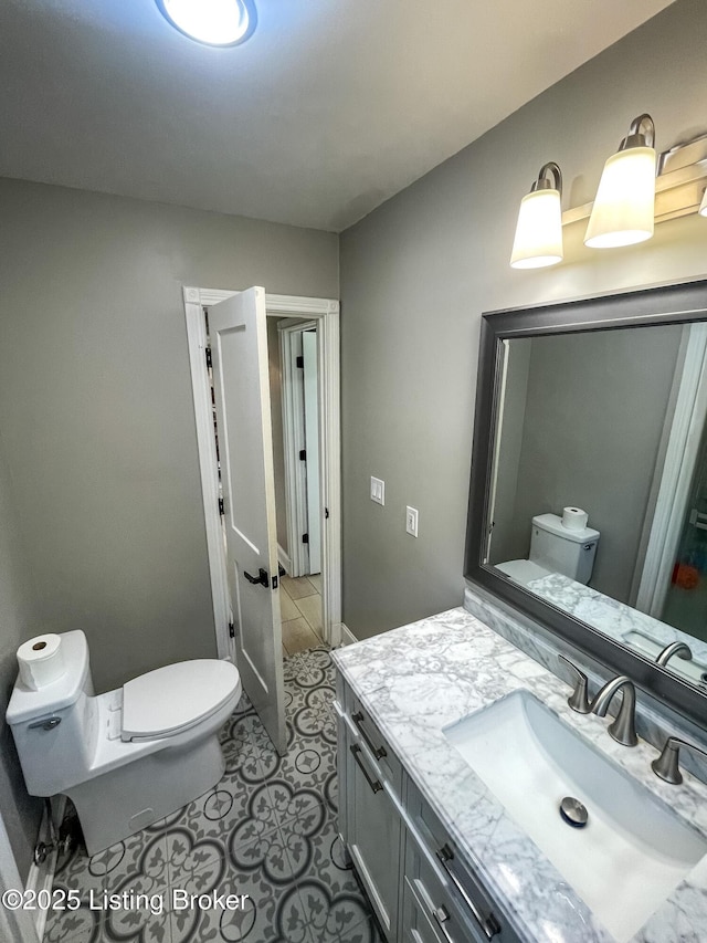 119 Fairway Dr, Hodgenville, KY 42748 - bathroom with vanity, tile patterned flooring, and toilet
