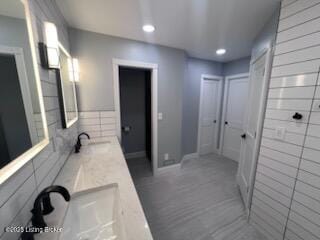 119 Fairway Dr, Hodgenville, KY 42748 - full bathroom featuring recessed lighting, double vanity, tiled shower, and a sink