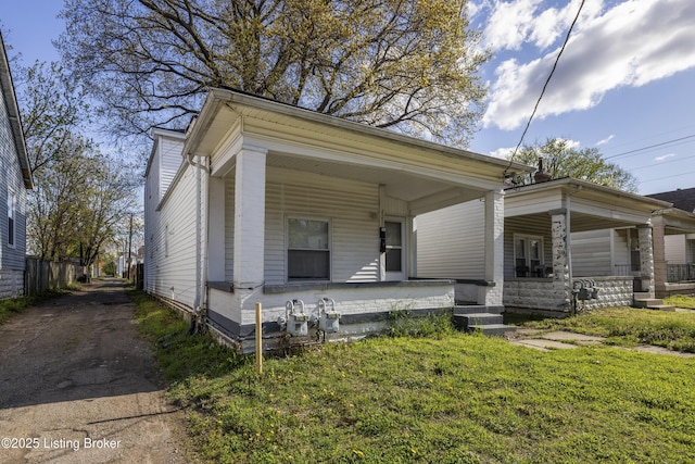 shotgun-style home with covered porch