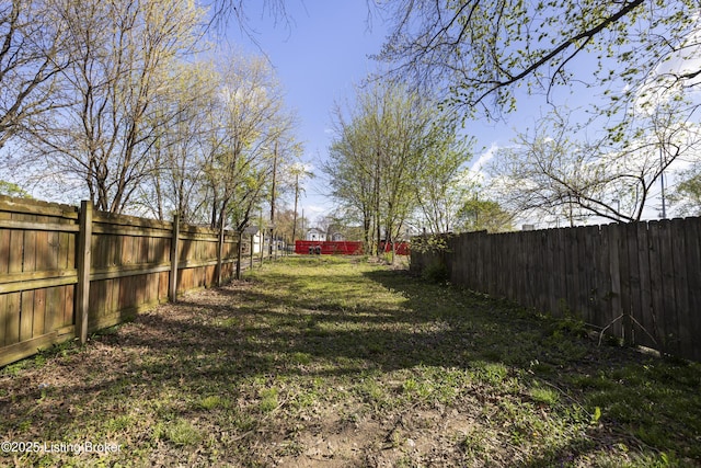 view of yard featuring a fenced backyard