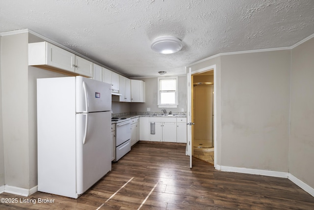 kitchen with white cabinets, light countertops, white appliances, dark wood-type flooring, and a textured ceiling