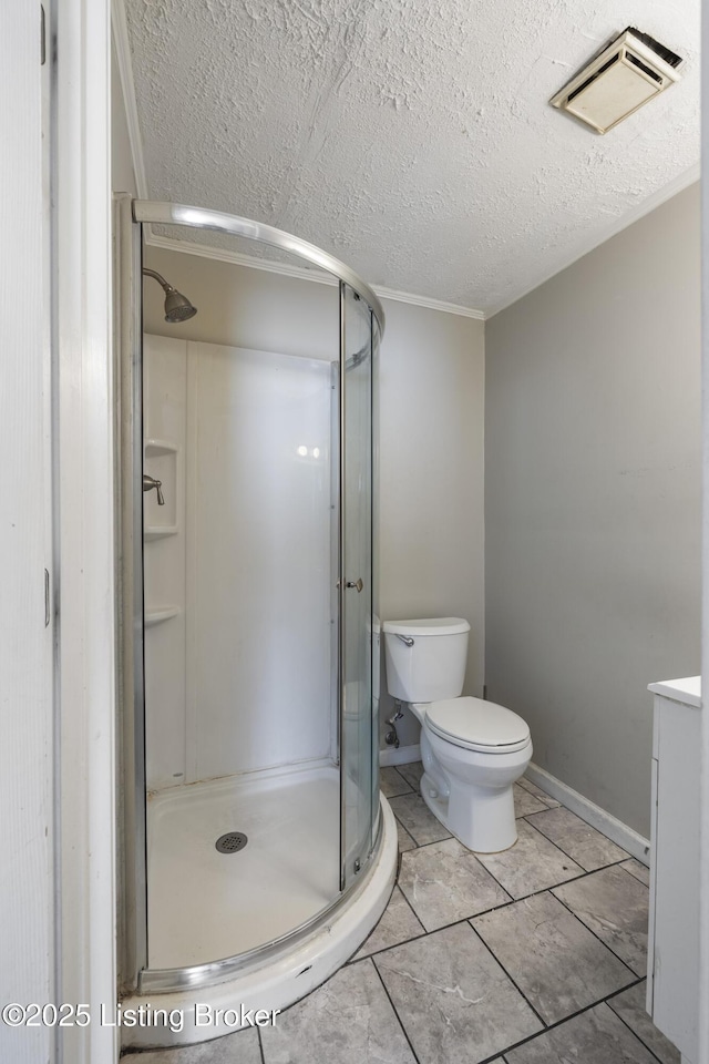 bathroom featuring toilet, visible vents, a textured ceiling, and a stall shower
