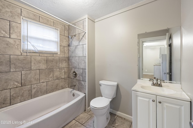 bathroom featuring tile patterned floors, a textured ceiling, toilet, shower / bathtub combination, and vanity