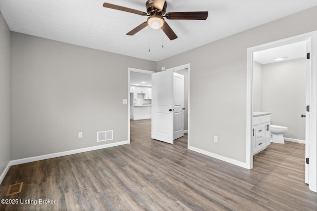 3408 Rhodelia Rd, Payneville, KY 40157 - unfurnished bedroom featuring wood finished floors, ensuite bath, and ceiling fan