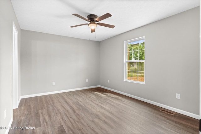 3408 Rhodelia Rd, Payneville, KY 40157 - empty room with ceiling fan and wood finished floors