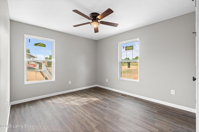 3408 Rhodelia Rd, Payneville, KY 40157 - spare room with dark wood-style flooring and a ceiling fan
