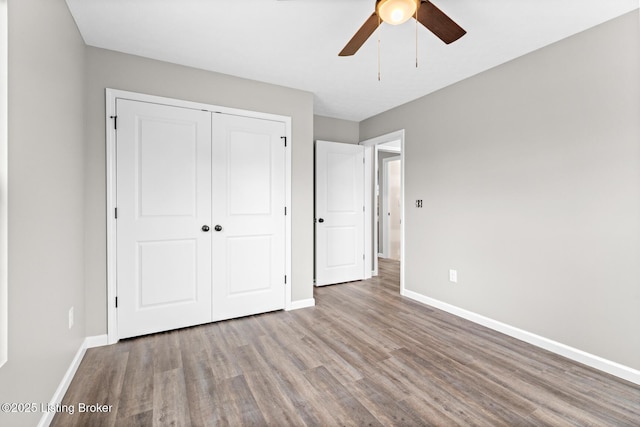 3408 Rhodelia Rd, Payneville, KY 40157 - unfurnished bedroom with wood finished floors, a closet, and ceiling fan