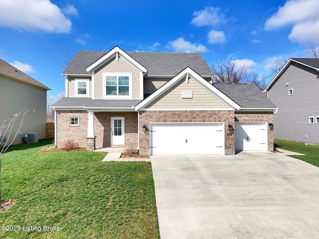 craftsman house featuring concrete driveway, a front lawn, brick siding, central AC, and a shingled roof