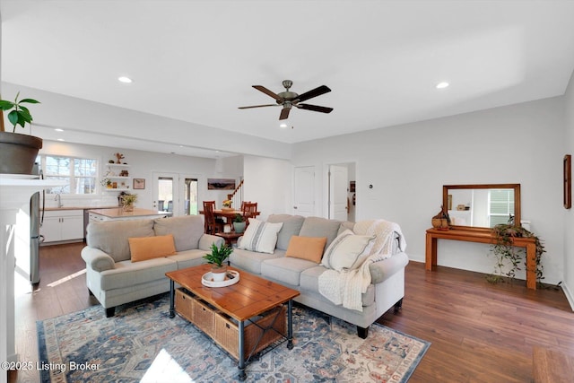 living room with dark wood-type flooring, ceiling fan, and recessed lighting