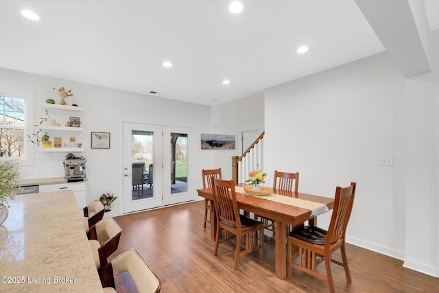 dining space with a healthy amount of sunlight, recessed lighting, baseboards, and wood finished floors