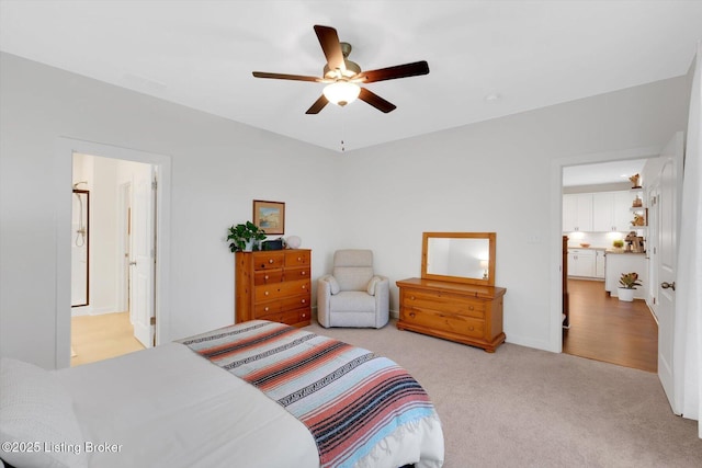 bedroom featuring light colored carpet and ceiling fan