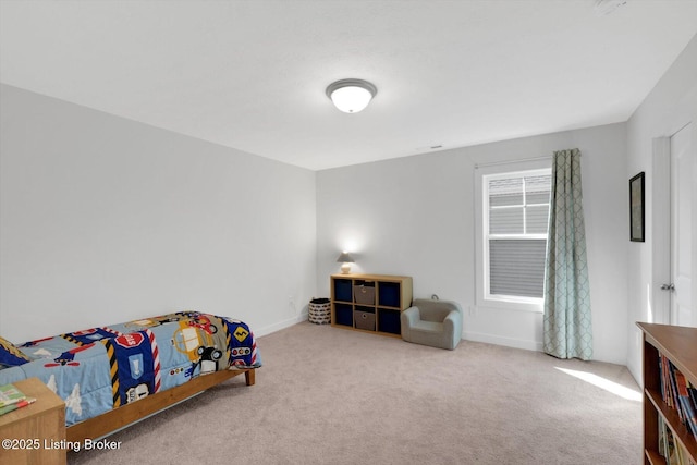 bedroom with carpet and baseboards