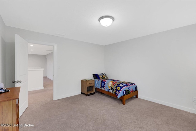 carpeted bedroom with baseboards
