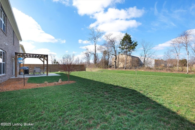 view of yard featuring a patio area, fence, and a pergola