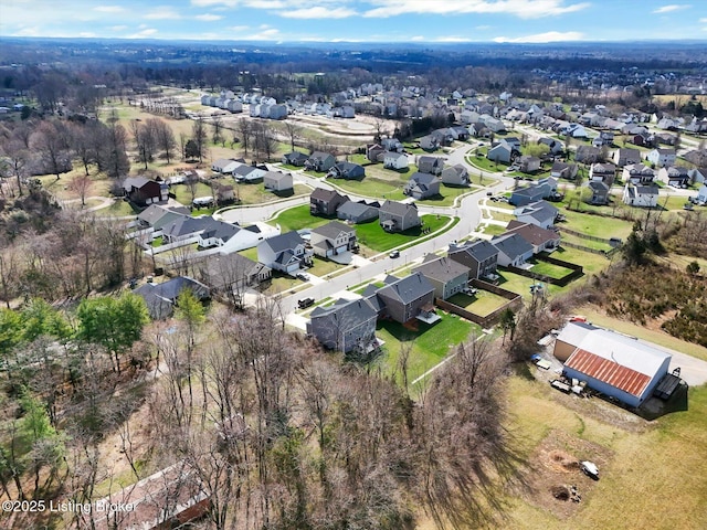 birds eye view of property with a residential view