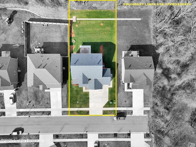 birds eye view of property with a residential view