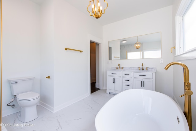 full bathroom featuring toilet, marble finish floor, a sink, double vanity, and baseboards
