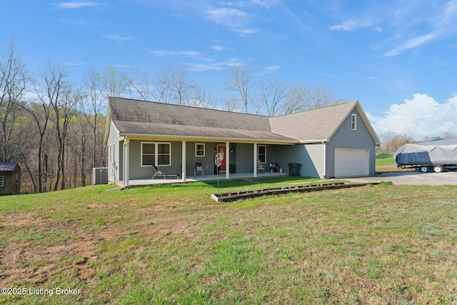 351 Serenity Cove Ln, Mammoth Cave, KY 42259 - single story home featuring aphalt driveway, central AC, an attached garage, and a front yard