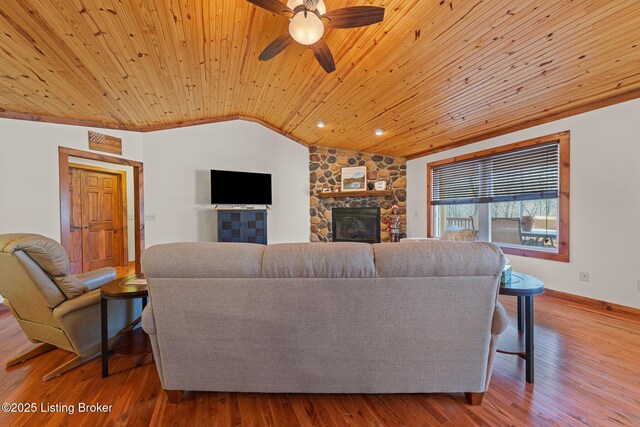 351 Serenity Cove Ln, Mammoth Cave, KY 42259 - living area featuring baseboards, a stone fireplace, a ceiling fan, wood ceiling, and lofted ceiling