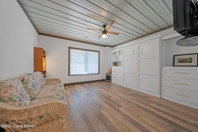 351 Serenity Cove Ln, Mammoth Cave, KY 42259 - living room with baseboards, wooden ceiling, ceiling fan, crown molding, and wood finished floors