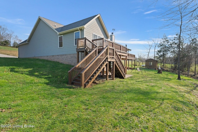 351 Serenity Cove Ln, Mammoth Cave, KY 42259 - back of property with stairway, a shed, an outbuilding, a deck, and a lawn