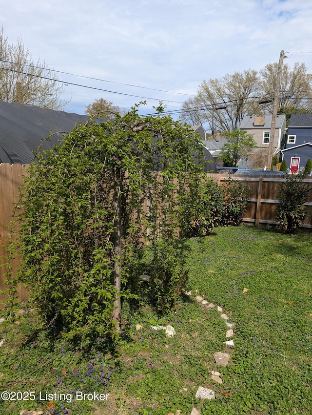 view of yard featuring fence