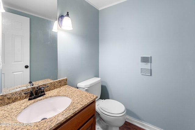 644 S 2nd St Unit 2, Louisville, KY 40202 - bathroom with baseboards, ornamental molding, toilet, vanity, and wood finished floors