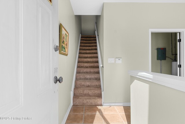 644 S 2nd St Unit 2, Louisville, KY 40202 - stairs with tile patterned floors and baseboards