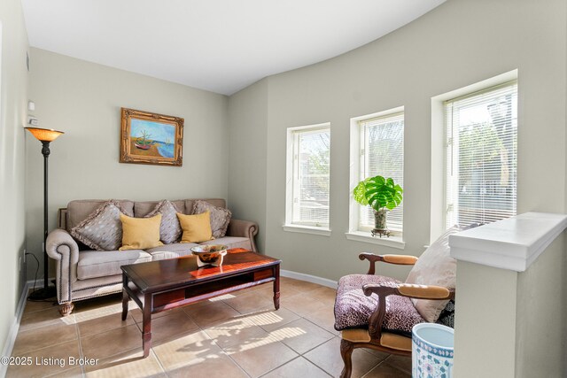 644 S 2nd St Unit 2, Louisville, KY 40202 - living room featuring baseboards, plenty of natural light, and light tile patterned flooring