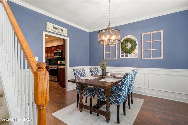 dining room with ornamental molding, dark wood finished floors, an inviting chandelier, and stairs