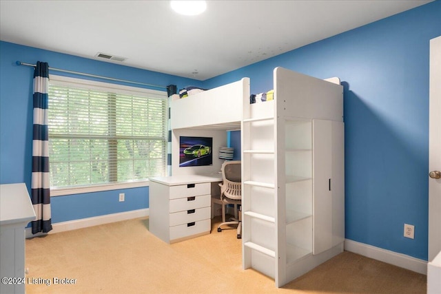 bedroom with light carpet, visible vents, and baseboards