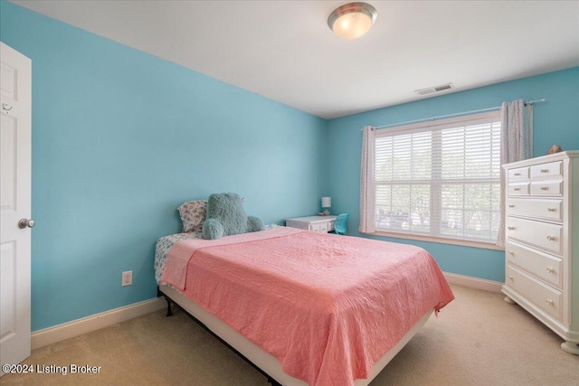 bedroom featuring light colored carpet, baseboards, and visible vents