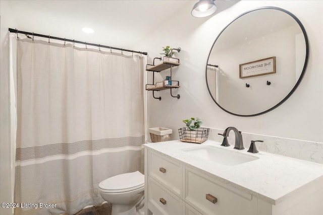 full bath with vanity and toilet