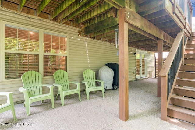 view of patio / terrace featuring french doors and stairway