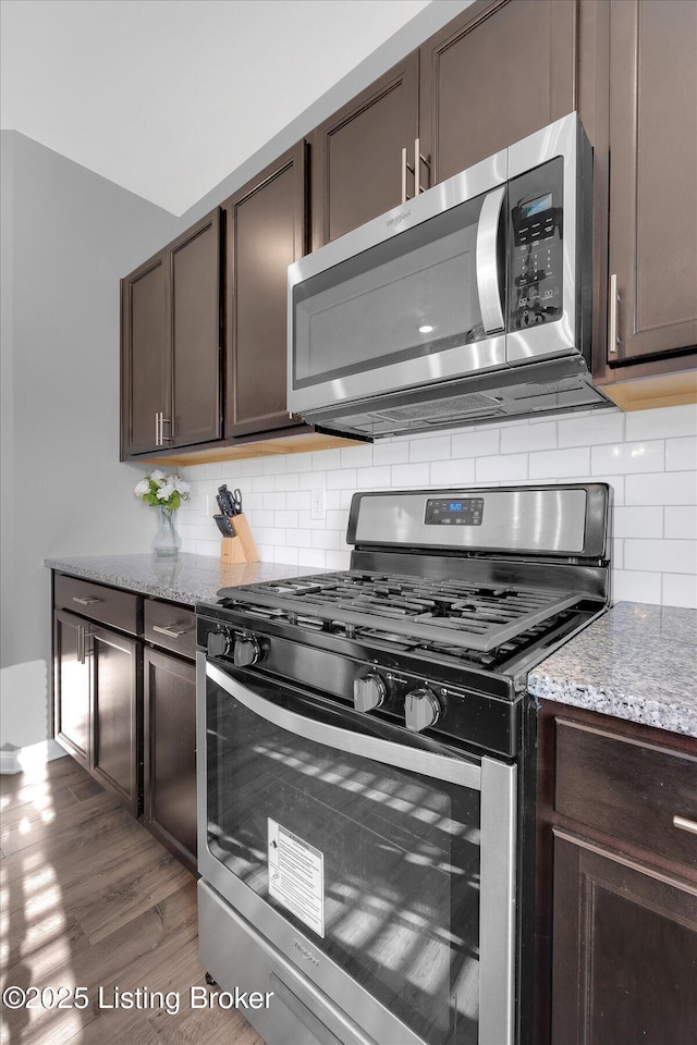 109 Kentucky Oaks Trl, Elizabethtown, KY 42701 - kitchen with appliances with stainless steel finishes, decorative backsplash, and dark brown cabinets