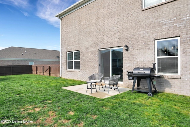 109 Kentucky Oaks Trl, Elizabethtown, KY 42701 - back of house with a yard, fence, brick siding, and a patio area