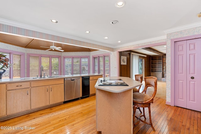 kitchen featuring stainless steel dishwasher, light wood-style floors, and wallpapered walls