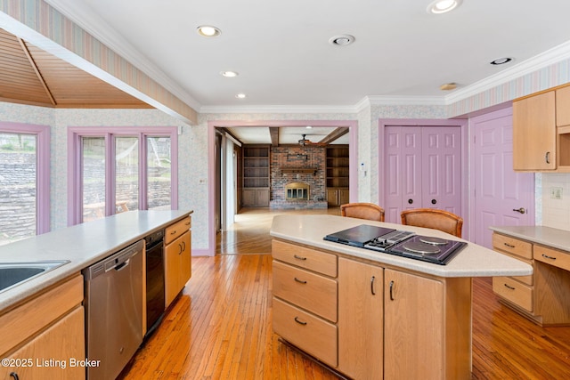 kitchen with crown molding, light brown cabinetry, dishwasher, black electric stovetop, and wallpapered walls