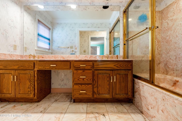 bathroom with a shower with shower door, wallpapered walls, a sink, and ornamental molding