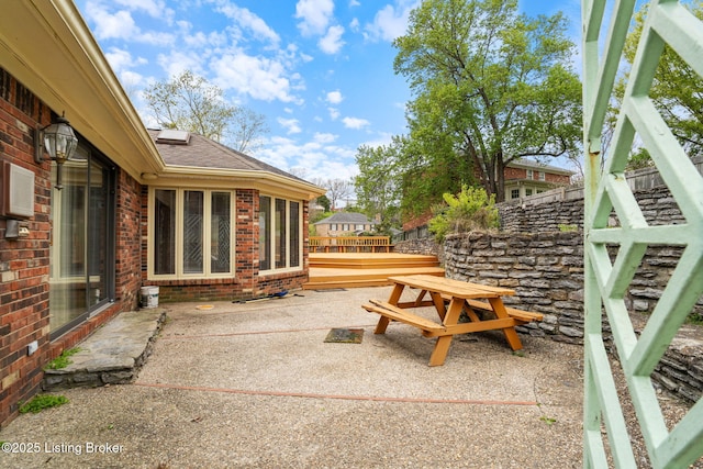 view of patio featuring fence