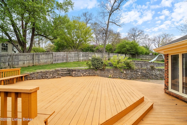wooden terrace featuring a fenced backyard